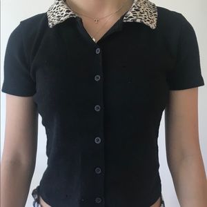 This is a buttoned up shirt with a cheetah print